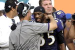MIAMI, FL - JANUARY 4:  Coach John Harbaugh of the Baltimore Ravens hugs wide receiver Derrick Mason #85 after play against the Miami Dolphins during their AFC Wild Card Game at Dolphins Stadium on January 4, 2009 in Miami, Floirda.  (Photo by Al Messerschmidt/Getty Images)