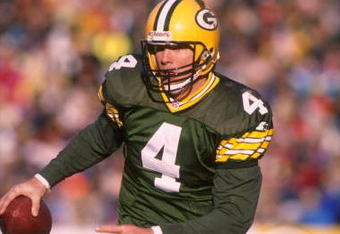 3 Dec 1995:  Quarterback Brett Favre #4 of the Green Bay Packers scrambles out of the pocket and scans the field for a receiver during the game against the Cincinnati Bengals at Lambeau Field in Green Bay, Wisconsin.  The Packers defeated the Bengals 24-1