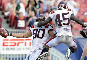 TAMPA, FL - DECEMBER 6: Defensive end Orion Martin #90 of the Virginia Tech Hokies celebrates a fumble recovery for a touchdown against the Boston College Eagles in the 2008 ACC Football Championship game at Raymond James Stadium on December 6, 2008 in Tampa, Florida.  (Photo by Al Messerschmidt/Getty Images)