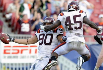 TAMPA, FL - DECEMBER 6: Defensive end Orion Martin #90 of the Virginia Tech Hokies celebrates a fumble recovery for a touchdown against the Boston College Eagles in the 2008 ACC Football Championship game at Raymond James Stadium on December 6, 2008 in Tampa, Florida.  (Photo by Al Messerschmidt/Getty Images)