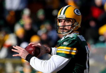 GREEN BAY, WI - DECEMBER 28: Aaron Rodgers #12 of the Green Bay Packers looks for a receiver against the Detroit Lions on December 28, 2008 at Lambeau Field in Green Bay, Wisconsin. The Packers defeated the Lions 31-21. (Photo by Jonathan Daniel/Getty Images)