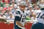 FOXBORO, MA - SEPTEMBER 7:  Quarterback Tom Brady #12 of the New England Patriots passes the ball up the middle during their NFL game against the Kansas City Chiefs on September 7, 2008 at Gillette Stadium in Foxboro, Massachusetts. The Patriots defeated the Chiefs 17-10. (Photo by Elsa Garrison/Getty Images)