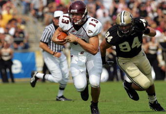 WEST LAFAYETTE, IN - SEPTEMBER 20:  Quarterback Dan LeFevour #13 of the Central Michigan Chippewas runs the ball past Ryan Kerrigan #94 of the Purdue Boilermakers at Ross-Ade Stadium on September 20, 2008 in West Lafayette, Indiana.  (Photo by Ronald Martinez/Getty Images)