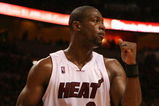 MIAMI - MAY 01:  Dwyane Wade #3 of the Miami Heat pumps his fist after the heat get a stop in the fourth quarter against the Atlanta Hawks during Game Six of the Eastern Conference Quarterfinals at American Airlines Arena on May 1, 2009 in Miami, Florida. The Heat defeated the Hawks 98-72. NOTE TO USER: User expressly acknowledges and agrees that, by downloading and/or using this Photograph, user is consenting to the terms and conditions of the Getty Images License Agreement.  (Photo by Doug Benc/Getty Images)