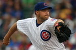 CHICAGO - JULY 8:  Aaron Heilman #47 of the Chicago Cubs pitches against the Atlanta Braves during the game on July 8, 2009 at Wrigley Field in Chicago, Illinois. (Photo by Jonathan Daniel/Getty Images) 