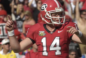 ATHENS, GA - SEPTEMBER 29: Quarterback Joe Cox #14 of the Georgia Bulldogs celebrates a late-game touchdown against the Mississippi Rebels at Sanford Stadium on September 29, 2007 in Athens, Georgia. (Photo by Al Messerschmidt/Getty Images)