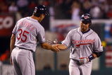 ANAHEIM, CA - JULY 27:  Jhonny Peralta #2 of the Cleveland Indians is congratulated by third base coach  Joel Skinner #35 after hitting a solo home run in the ninth inning against the Los Angeles Angels of Anaheim at Angel Stadium on July 27, 2009 in Anaheim, California. The Indians defeated the Angels 8-6.  (Photo by Jeff Gross/Getty Images)