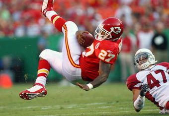 KANSAS CITY, MO - AUGUST 16:  Larry Johnson #27 of the Kansas City Chiefs is upended by Aaron Francisco #47 during a preseason game against the Arizona Cardinals on August 16, 2008 at Arrowhead Stadium in Kansas City, Mo.  (Photo by G. Newman Lowrance/Getty Images)