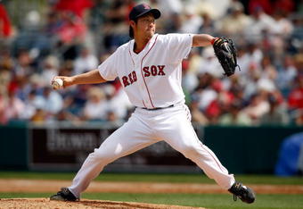 FORT MYERS, FL - MARCH 08:  Pitcher Junichi Tazawa #86 of the Boston Red Sox pitches against the Tampa Bay Rays during a Grapefruit League Spring Training Game at City of Palms Park on March 8, 2009 in Fort Myers, Florida.  (Photo by J. Meric/Getty Images)