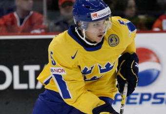 OTTAWA, ON - JANUARY 3:  Erik Karlsson #5 of Team Sweden skates with the puck during the game against Team Slovakia at the semifinals at the IIHF World Junior Championships at Scotiabank Place on January 03, 2009 in Ottawa, Ontario, Canada.  Team Sweden defeated Team Slovakia 5-3.  (Photo by Richard Wolowicz/Getty Images)