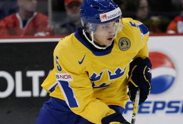 OTTAWA, ON - JANUARY 3:  Erik Karlsson #5 of Team Sweden skates with the puck during the game against Team Slovakia at the semifinals at the IIHF World Junior Championships at Scotiabank Place on January 03, 2009 in Ottawa, Ontario, Canada.  Team Sweden defeated Team Slovakia 5-3.  (Photo by Richard Wolowicz/Getty Images)