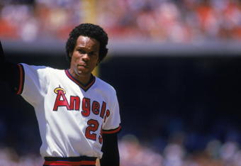 ANAHEIM, CA - AUGUST 4:  Infielder Rod Carew #29 of the California Angels waves to the home crowd after making his 3,000th hit by singling against his former club, the Minnesota Twins during the MLB game at Angel Stadium on August 4, 1985 in Anaheim, California. The Angels defeated the Twins 6-5. (Photo by Getty Images)