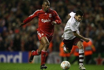 LIVERPOOL, UNITED KINGDOM - APRIL 08:  Ryan Babel of Liverpool surges past Cesc Fabregas of Arsenal on the way to scoring his team's fourth goal during the UEFA Champions League Quarter Final, second leg match between Liverpool and Arsenal at Anfield on April 8, 2008 in Liverpool, England.  (Photo by Clive Brunskill/Getty Images)