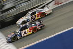 FONTANA, CA - FEBRUARY 22: Brian Vickers, driver of the #83 Red Bull Toyota, races teammate Scott Speed, driver of the #82 Red Bull Toyota, during the NASCAR Sprint Cup Series Auto Club 500 at Auto Club Speedway on February 22, 2009 in Fontana, California.  (Photo by Geoff Burke/Getty Images for NASCAR)