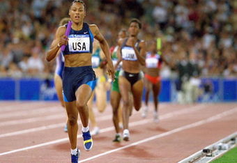 30 Sep 2000:  Marion Jones of the USA on her way to winning Gold in the Womens 4x400m Relay Final at the Olympic Stadium on Day 15 of the Sydney 2000 Olympic Games in Sydney, Australia. \ Mandatory Credit: Andy Lyons /Allsport