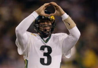 01 Jan 2002 : Joey Harrington of Oregon celebrates his third quarter touchdown against Colorado during the game at the  Fiesta Bowl at Sun Devil Stadium in Tempe, Arizona. The Oregon Ducks won 38-16. DIGITAL IMAGE. Mandatory Credit: Brian Bahr/Getty Images