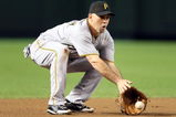 PHOENIX - JULY 25:  Infielder Jack Wilson #2 of the Pittsburgh Pirates fields a ground ball out against the Arizona Diamondbacks during the major league baseball game at Chase Field on July 25, 2009 in Phoenix, Arizona.  (Photo by Christian Petersen/Getty Images)