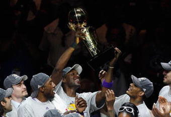 ORLANDO, FL - JUNE 14:  Lamar Odom #7 of the Los Angeles Lakers holds up the Larry O'Brien trophy after the Lakers defeated the Orlando Magic 99-86 in Game Five of the 2009 NBA Finals on June 14, 2009 at Amway Arena in Orlando, Florida.  NOTE TO USER:  User expressly acknowledges and agrees that, by downloading and or using this photograph, User is consenting to the terms and conditions of the Getty Images License Agreement.