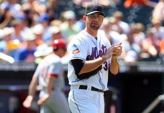NEW YORK - JULY 12:  Mike Pelfrey #34 of the New York Mets pitches against the Cincinnati Reds on July 12, 2009 at Citi Field in the Flushing neighborhood of the Queens borough of New York City.  (Photo by Jim McIsaac/Getty Images)