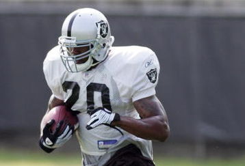 NAPA, CA - JULY 25:  Running back Darren McFadden #20 runs with the ball during a morning session as the Oakland Raiders start their camp at the Marriott Hotel on July 25, 2008 in Napa, California. (Photo by Sara Wolfram/Getty Images)