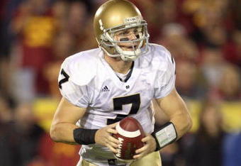 LOS ANGELES - NOVEMBER 29:  Quarterback Jimmy Clausen #7 of the Notre Dame Fighting Irish moves back to pass the ball during the game against the USC Trojans at the Memorial Coliseum on November 29, 2008 in Los Angeles, California. (Photo by: Jeff Gross/Getty Images)