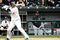 CHICAGO - OCTOBER 05:  Manager Ozzie Guillen #13 of the Chicago White Sox looks on as Orlando Cabrera #18 bats against the Tampa Bay Rays in Game Three of the ALDS during the 2008 MLB Playoffs at U.S. Cellular Field on October 5, 2008 in Chicago, Illinois.  (Photo by Jamie Squire/Getty Images)