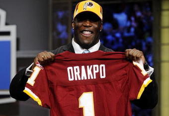 NEW YORK - APRIL 25:   Washington Redskins #13 draft pick Brian Orakpo poses for photographers at Radio City Music Hall for the 2009 NFL Draft on April 25, 2009 in New York City  (Photo by Jeff Zelevansky/Getty Images)
