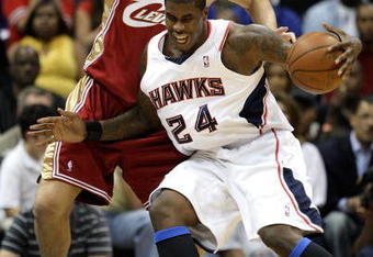 ATLANTA - MAY 11:  Marvin Williams #24 of the Atlanta Hawks drives into Wally Szczerbiak #10 of the Cleveland Cavaliers during Game Four of the Eastern Conference Semifinals during the 2009 NBA Playoffs at Philips Arena on May 11, 2009 in Atlanta, Georgia.  NOTE TO USER: User expressly acknowledges and agrees that, by downloading and/or using this Photograph, user is consenting to the terms and conditions of the Getty Images License Agreement.  (Photo by Andy Lyons/Getty Images)