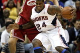 ATLANTA - MAY 11:  Marvin Williams #24 of the Atlanta Hawks drives into Wally Szczerbiak #10 of the Cleveland Cavaliers during Game Four of the Eastern Conference Semifinals during the 2009 NBA Playoffs at Philips Arena on May 11, 2009 in Atlanta, Georgia.  NOTE TO USER: User expressly acknowledges and agrees that, by downloading and/or using this Photograph, user is consenting to the terms and conditions of the Getty Images License Agreement.  (Photo by Andy Lyons/Getty Images)