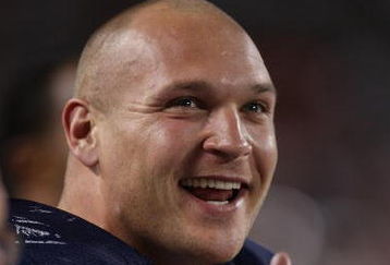 CHICAGO - AUGUST 07: Brian Urlacher #54 of the Chicago Bears enjoys watching his teammates play against the Kansas City Chiefs on August 7, 2008 at Soldier Field in Chicago, Illinois. The Chiefs defeated the Bears 24-20. (Photo by Jonathan Daniel/Getty Images)