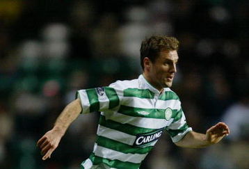 GLASGOW - DECEMBER 13:  Jamie Smith of Celtic runs with the ball during the Scottish Premier League match between Glasgow Celtic and Dundee held on December 13, 2003 at Celtic Park, in Glasgow, Scotland. Glasgow Celtic won the match 3-2. (Photo by Bryn Lennon/Getty Images)