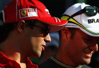 BUDAPEST, HUNGARY - JULY 24:  Felipe Massa (L) of Brazil and Ferrari and Rubens Barrichello (R) of Brazil and Brawn GP walk down the paddock following practice for the Hungarian Formula One Grand Prix at the Hungaroring on July 24, 2009 in Budapest, Hungary.  (Photo by Ryan Pierse/Getty Images)