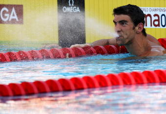 ROME - JULY 29:  Michael Phelps of the United States celebrates after breaking the world record, setting a new time of 1:51.51 seconds in the Men's 200m Butterfly Final during the 13th FINA World Championships at the Stadio del Nuoto on July 29, 2009 in Rome, Italy.  (Photo by Quinn Rooney/Getty Images)