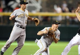 PHOENIX - JULY 25:  Infielder Jack Wilson #2 of the Pittsburgh Pirates bobbles the ball after getting the force out on Stephen Drew #6 of the Arizona Diamondbacks during the first inning of the major league baseball game at Chase Field on July 25, 2009 in Phoenix, Arizona.  (Photo by Christian Petersen/Getty Images)