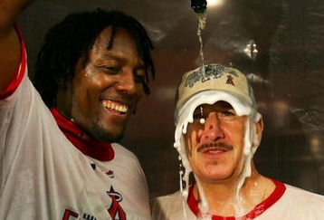ANAHEIM, CA - SEPTEMBER 23:   (L-R) Vladimir Guerrero (L) celebrates with team owner Arte Moreno of the Los Angeles Angels of Anaheim celebrates in the locker room after defeating the Seattle Mariners 7-4 to win the American League Western Division at Angels Stadium September 23, 2007 in Anaheim, California.  (Photo by Lisa Blumenfeld/Getty Images)