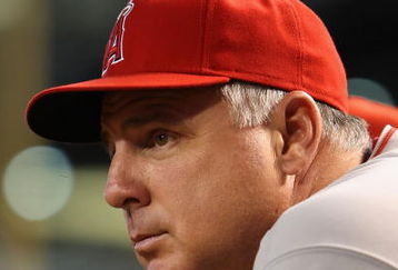 PHOENIX - JUNE 27:  Manager Mike Scioscia of the Los Angeles Angels of Anaheim watches from the dugout during the major league baseball game against the Arizona Diamondbacks at Chase Field on June 27, 2009 in Phoenix, Arizona. The Angels defeated the Diamondbacks 2-1.  (Photo by Christian Petersen/Getty Images)