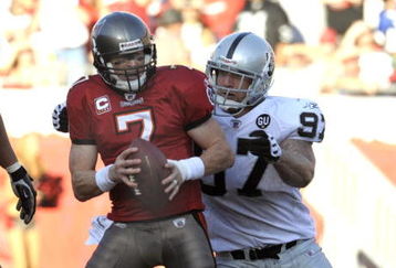 TAMPA, FL - DECEMBER 28: Defensive end Greyson Gunheim #97 of the Oakland Raiders sacks quarterback Jeff Garcia #7 of the Tampa Bay Buccaneers at Raymond James Stadium on December 28, 2008 in Tampa, Florida.  (Photo by Al Messerschmidt/Getty Images)