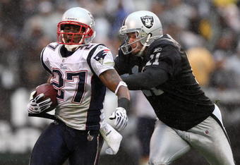 OAKLAND, CA - DECEMBER 14: Ellis Hobbs #27 of the New England Patriots returns a kick off 95 yards for a touchdown as kicker Sebastian Janikowski #11 of the Oakland Raiders defends during an NFL game on December 14, 2008 at the Oakland-Alameda County Coliseum in Oakland, California.  (Photo by Jed Jacobsohn/Getty Images)