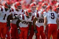 LOUISVILLE, KY - SEPTEMBER 22:  Quarterback Andrew Robinson #9 of the Syracuse Orange calls a play in the huddlle while playing the Louisville Cardinals at Papa John's Cardinal Stadium September 22, 2007 in Louisville, Kentucky.  (Photo by Matthew Stockman/Getty Images)