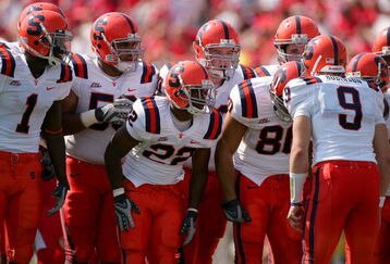LOUISVILLE, KY - SEPTEMBER 22:  Quarterback Andrew Robinson #9 of the Syracuse Orange calls a play in the huddlle while playing the Louisville Cardinals at Papa John's Cardinal Stadium September 22, 2007 in Louisville, Kentucky.  (Photo by Matthew Stockman/Getty Images)