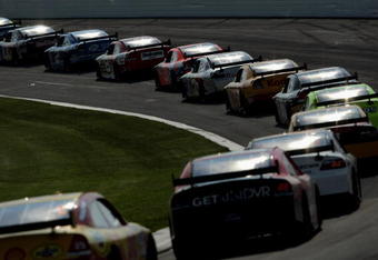 LONG POND, PA - JUNE 08:  The field makes its way through turn number two, the tunnel turn, during the NASCAR Sprint Cup Series Pocono 500 on June 8, 2008 at Pocono International Raceway in Long Pond, Pennsylvania.  (Photo by Doug Pensinger/Getty Images for NASCAR)