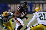 CHICAGO - DECEMBER 22: Matt Forte #22 of the Chicago Bears runs for yardage against Alfred Malone #98 and Charles Woodson #21 of the Green Bay Packers on December 22, 2008 at Soldier Field in Chicago, Illinois. The Bears defeated the Packers 20-17 in overtime. (Photo by Jonathan Daniel/Getty Images)