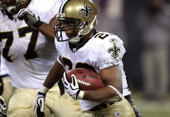 CHICAGO - DECEMBER 11:  Pierre Thomas #23 of the New Orleans Saints runs the ball against the Chicago Bears at Soldier Field on December 11, 2008 in Chicago, Illinois.  (Photo by Jonathan Daniel/Getty Images)