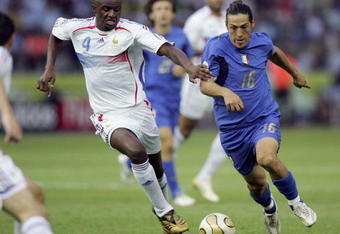 BERLIN - JULY 09:  Patrick Vieira (L) of France and Mauro Camoranesi of Italy battle for the ball during the FIFA World Cup Germany 2006 Final match between Italy and France at the Olympic Stadium on July 9, 2006 in Berlin, Germany.  (Photo by Ben Radford/Getty Images)