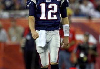 GLENDALE, AZ - FEBRUARY 03:  Quarterback Tom Brady #12 of the New England Patriots walks off the field in the second half of Super Bowl XLII against the New York Giants on February 3, 2008 at the University of Phoenix Stadium in Glendale, Arizona.  The Giants defeated the Patriots 17-14. (Photo by Donald Miralle/Getty Images)