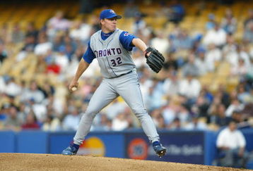 LOS ANGELES, CA - JUNE 18:  Pitcher Roy Halladay#32 the Toronto Blue Jays winds back to pitch the ball during the game against the Los Angeles Dodgers on June 18, 2002 at Dodger Stadium in Los Angeles, California. The Blue Jays won 2-1.  (Photo by Jeff Gross/Getty Images)