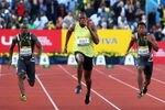 LONDON, ENGLAND - JULY 24:  Usain Bolt of Jamaica outsprints Daniel Bailey (L) of Antigua and Yohan Blake (R) of Jamaica in the Men's 100m Final during day one of the Aviva London Grand Prix track and field meeting at Crystal Palace Stadium on July 24, 2009 in London, England.  (Photo by John Gichigi/Getty Images)