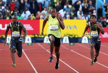 LONDON, ENGLAND - JULY 24:  Usain Bolt of Jamaica outsprints Daniel Bailey (L) of Antigua and Yohan Blake (R) of Jamaica in the Men's 100m Final during day one of the Aviva London Grand Prix track and field meeting at Crystal Palace Stadium on July 24, 2009 in London, England.  (Photo by John Gichigi/Getty Images)
