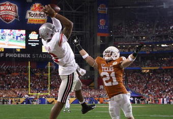 GLENDALE, AZ - JANUARY 05:  Terrelle Pryor #2 of the Ohio State Buckeyes makes a leaping 5 yard touchdown reception over Blake Gideon #21 of the Texas Longhorns during the fourth quarter of the Tostitos Fiesta Bowl Game on January 5, 2009 at University of Phoenix Stadium in Glendale, Arizona.  (Photo by Jed Jacobsohn/Getty Images)