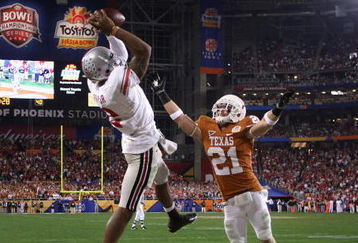 GLENDALE, AZ - JANUARY 05:  Terrelle Pryor #2 of the Ohio State Buckeyes makes a leaping 5 yard touchdown reception over Blake Gideon #21 of the Texas Longhorns during the fourth quarter of the Tostitos Fiesta Bowl Game on January 5, 2009 at University of Phoenix Stadium in Glendale, Arizona.  (Photo by Jed Jacobsohn/Getty Images)